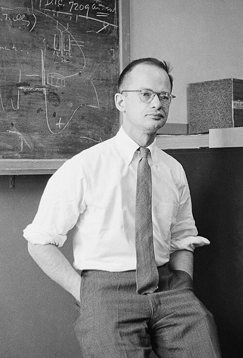 Walter Pitts standing at a blackboard, 1954